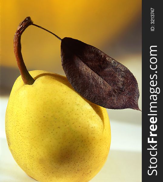 Pear on a yellow background