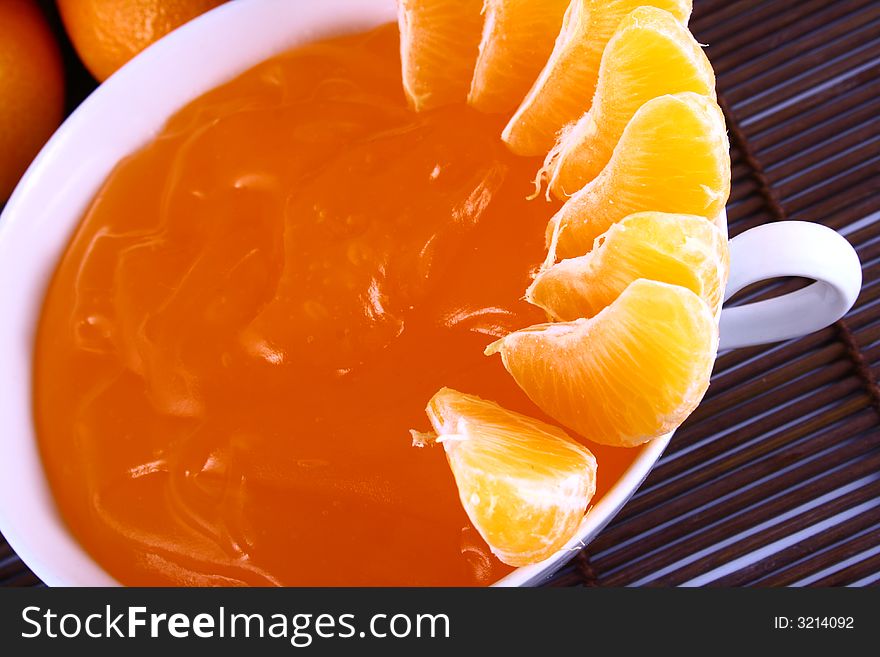 Orange Ripe tangerines on a white background with jelly. Orange Ripe tangerines on a white background with jelly