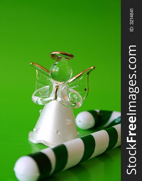 Glass Angel and Green and white candy stick. Glass Angel and Green and white candy stick