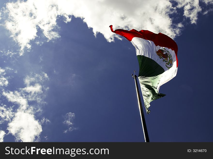 Mexican Flag, Independence day september 16: three equal vertical bands of green (hoist side), white, and red; the coat of arms (an eagle perched on a cactus with a snake in its beak) is centered in the white band
