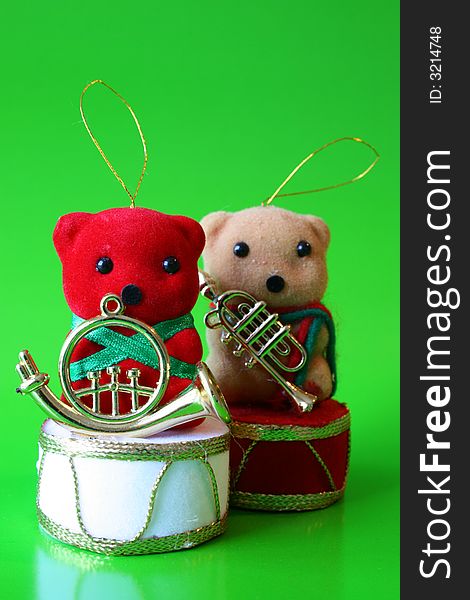 Two Christmas Bear decorations on a green background. Two Christmas Bear decorations on a green background