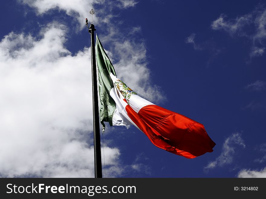 Mexican Flag, Independence day september 16: three equal vertical bands of green (hoist side), white, and red; the coat of arms (an eagle perched on a cactus with a snake in its beak) is centered in the white band