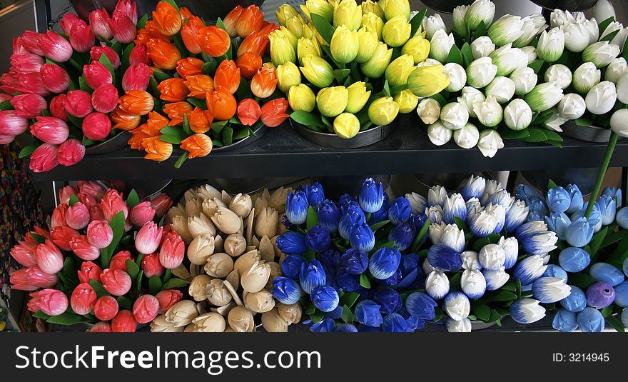 Beautiful wooden tulips in red, orange, yellow, white and blue. Beautiful wooden tulips in red, orange, yellow, white and blue