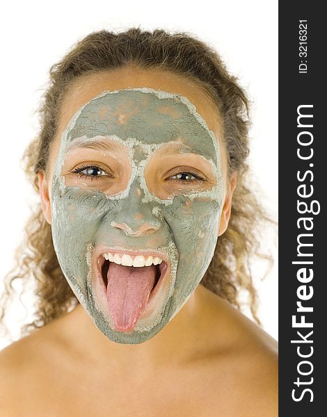 Young woman with face mask sticking her tongue. She's on white background. She's looking at camera. Young woman with face mask sticking her tongue. She's on white background. She's looking at camera.