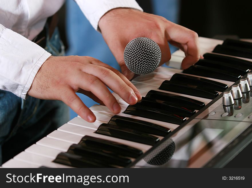 Close-up photo of hands of piano player