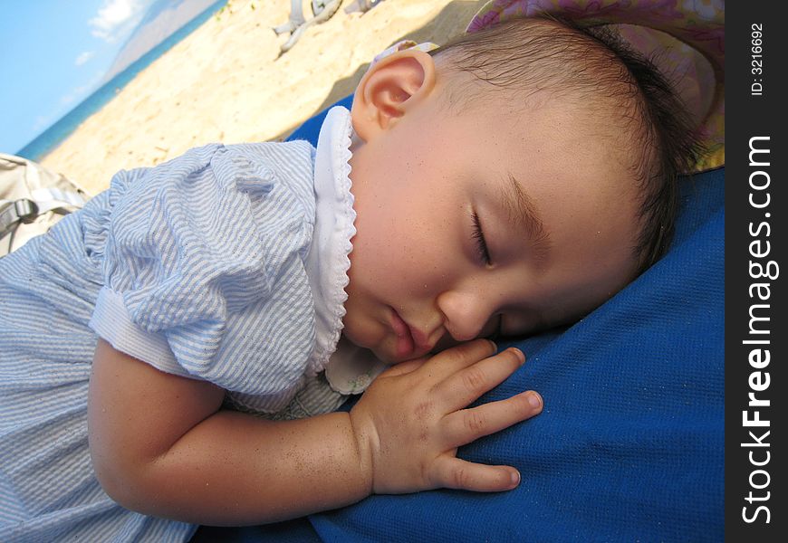 Nine Months old baby girl sleeping on the beach. Nine Months old baby girl sleeping on the beach