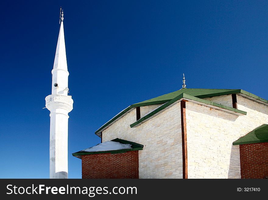 Little mosque and white minaret