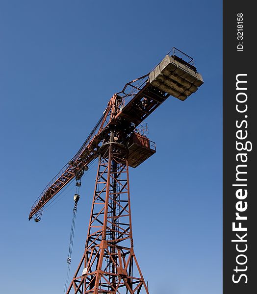 Red crane and blue sky.