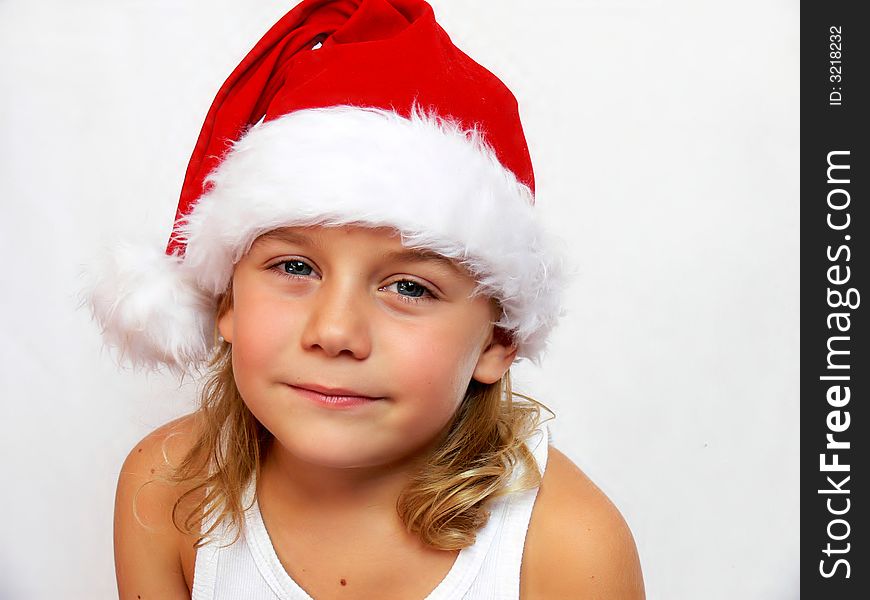 Child with santa hat on a white background