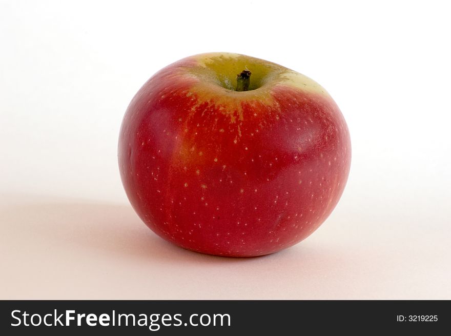 One red apple on isolated white