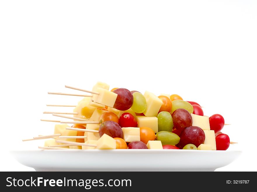 Many fruit shashlik arranged on a plate. Many fruit shashlik arranged on a plate.