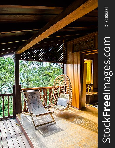 Chairs inside a wooden house resort, at the Dusun, Malaysia