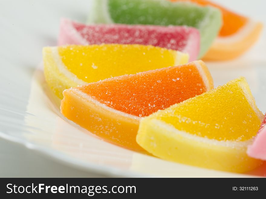 Color fruit jelly candies on a plate. Color fruit jelly candies on a plate