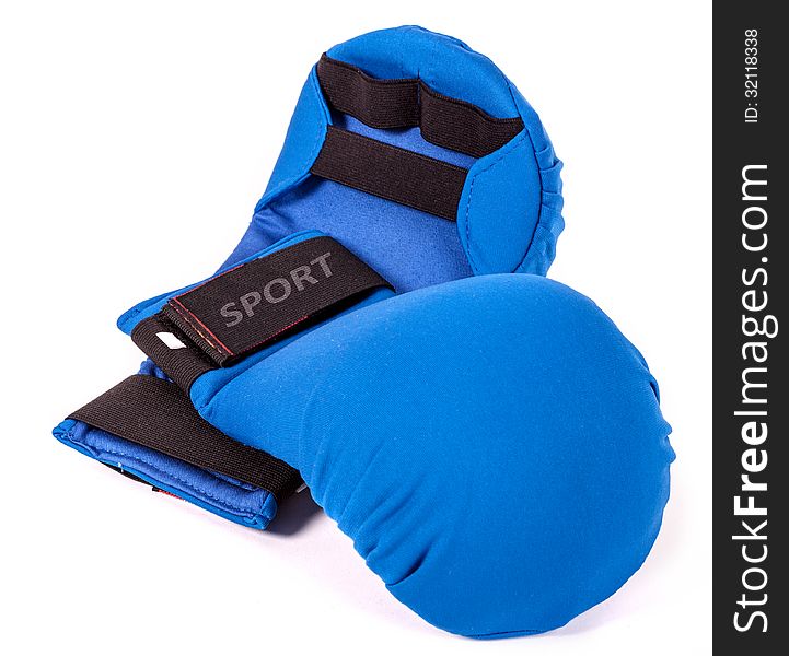 Blue karate gloves on white background with black slip. Blue karate gloves on white background with black slip