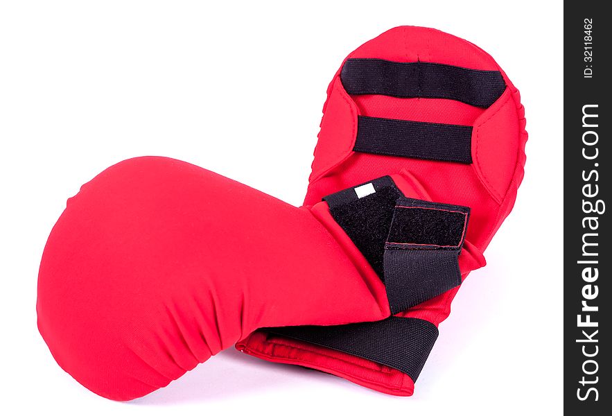 Red karate gloves on white background with black slip