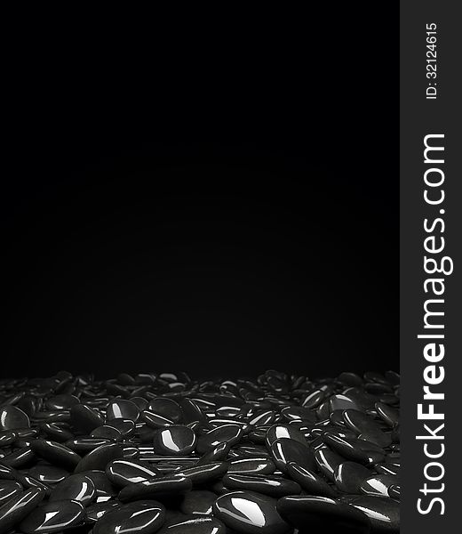 Stones scattered on the surface of a black background. Stones scattered on the surface of a black background
