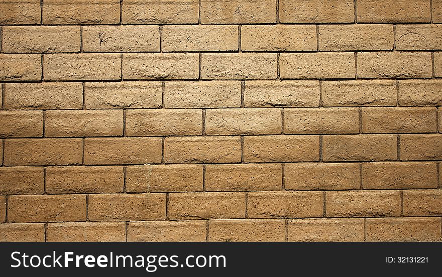 A brown cinder block wall