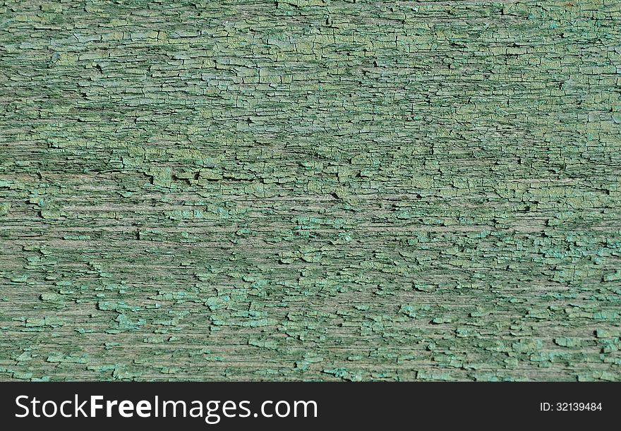 Old green colored cracked wood texture. Old green colored cracked wood texture