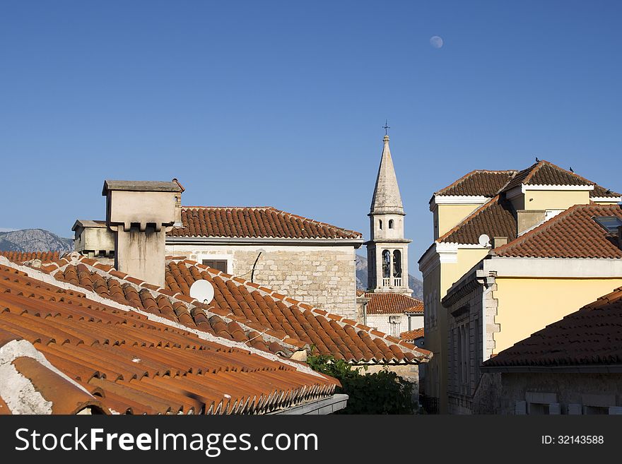 Early evening view to the Budva Old City with moon on the sky. Early evening view to the Budva Old City with moon on the sky