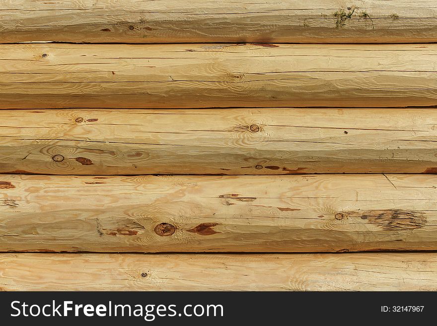 Background of stacked pine logs. Background of stacked pine logs