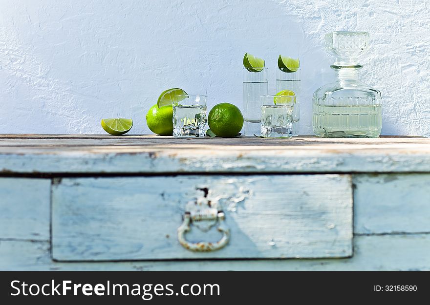 Tequila and lime on a old table