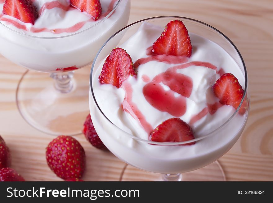 Strawberry Yogurt On A Wooden Background