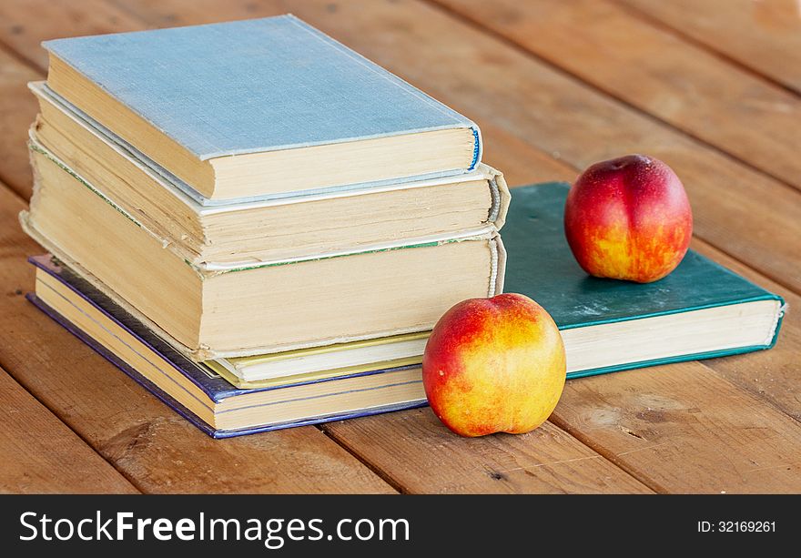 A Stack of old books on wooden background