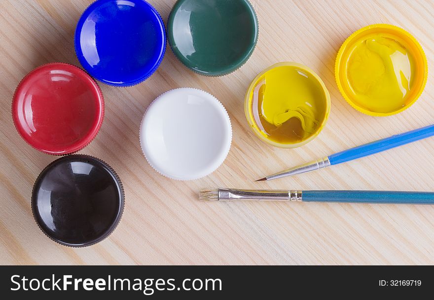 Brush And Many Paint Jars