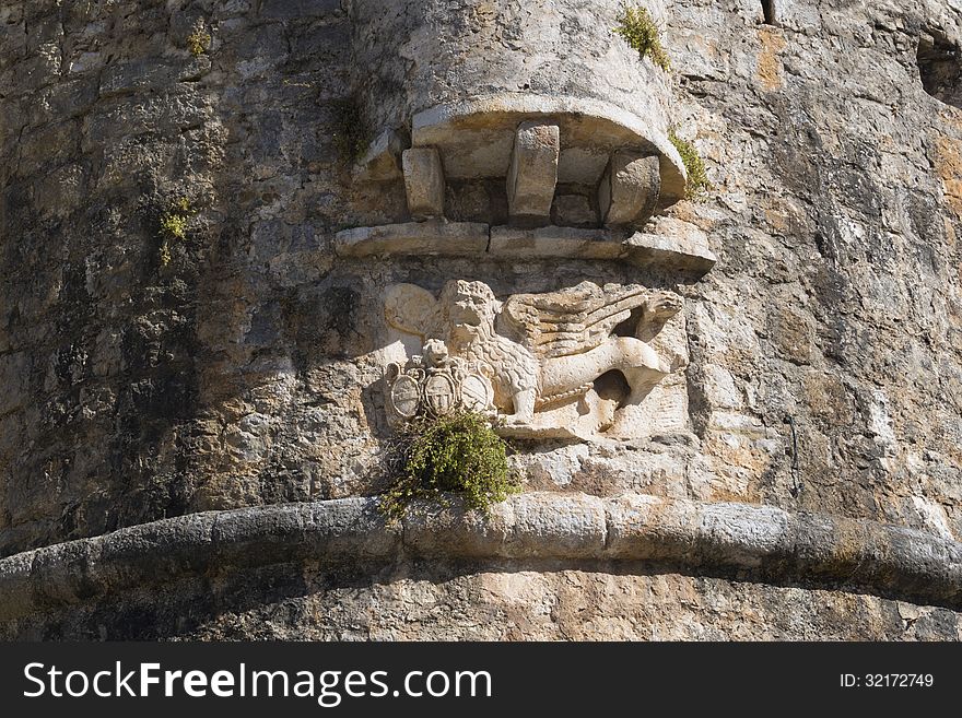 Guard lion sculpture on the Budva old city wall in Montenegro