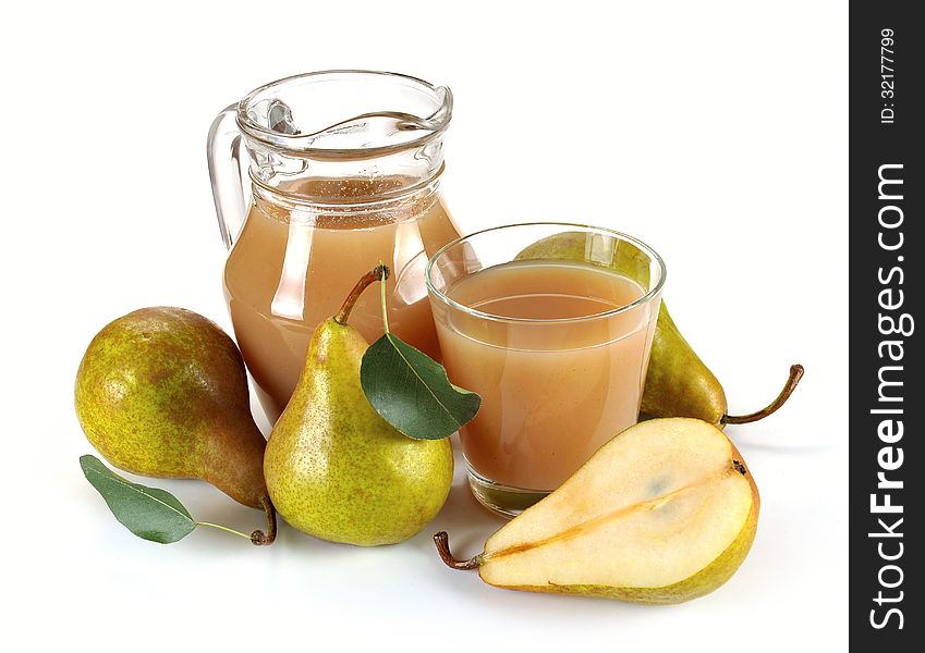 Pear juice in a jug and a glass of fruit. Pear juice in a jug and a glass of fruit