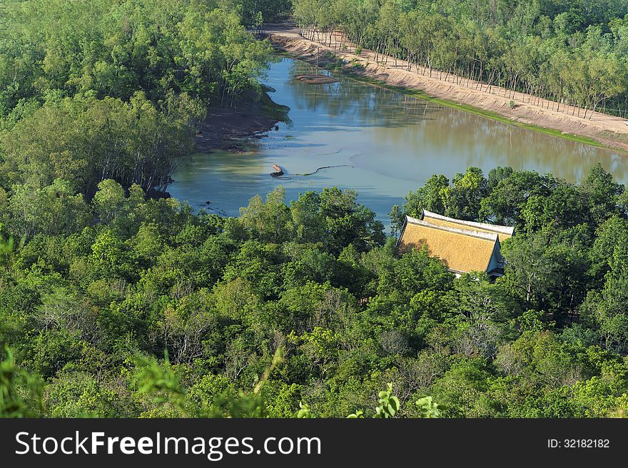 Pavilion yellow roof on tree river.