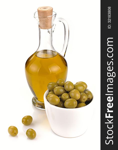 Decanter with olive oil isolated on white background