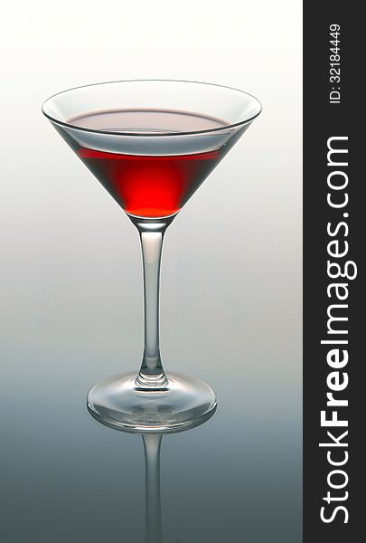 Martini glass with red coctail