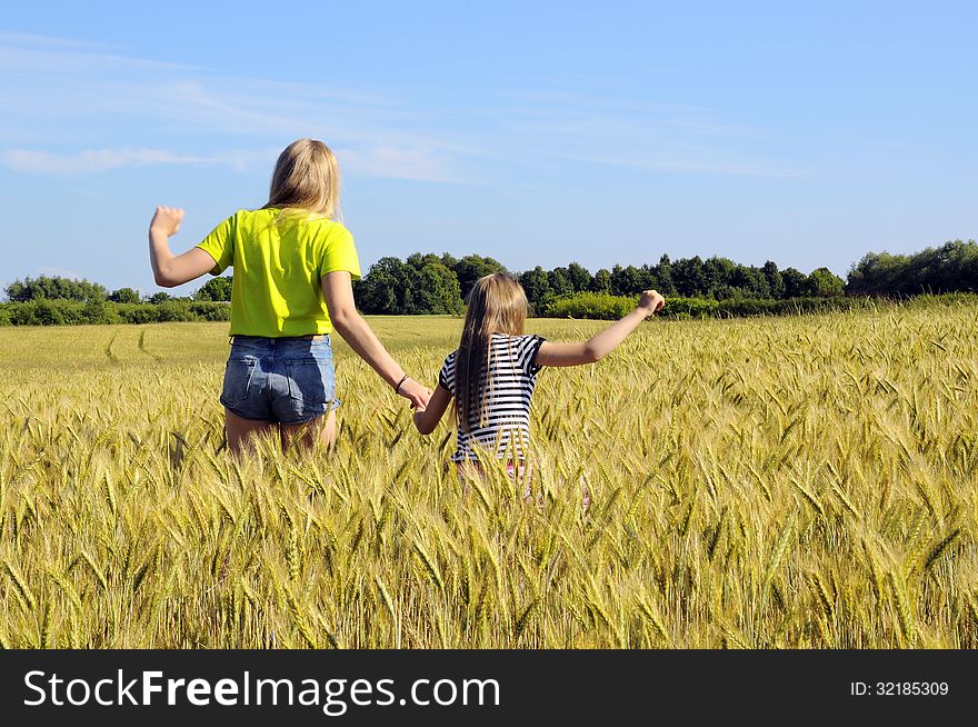 Sisters in summer field of wheat. Sisters in summer field of wheat