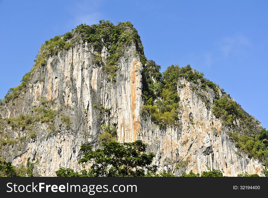 Exotic high cliffs of limestone mountain. Thailand. Exotic high cliffs of limestone mountain. Thailand