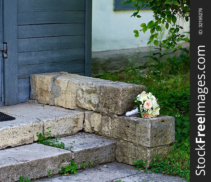 Beautiful Bride Bouquet Forgotten on Stone Steps outdoors. Beautiful Bride Bouquet Forgotten on Stone Steps outdoors