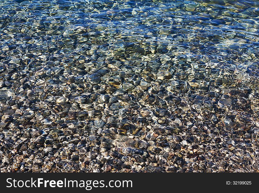 Pebbles Under The Clear Sea Water