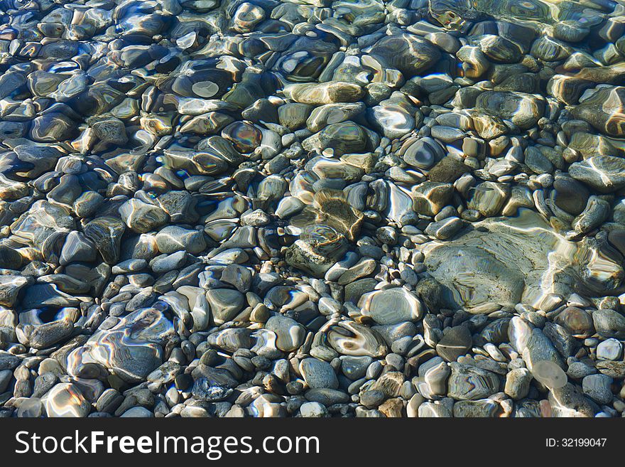 Pebbles Under The Clear Sea Water