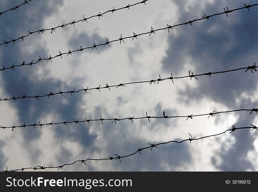 Sky behind barbed wire, no freedom concept background