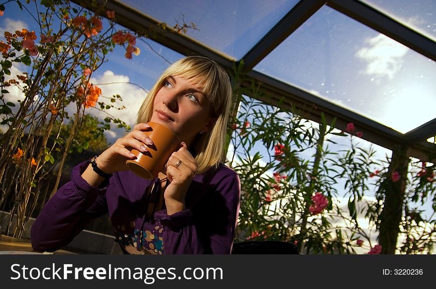 Beautiful thoughtful girl sitting in a restaurant