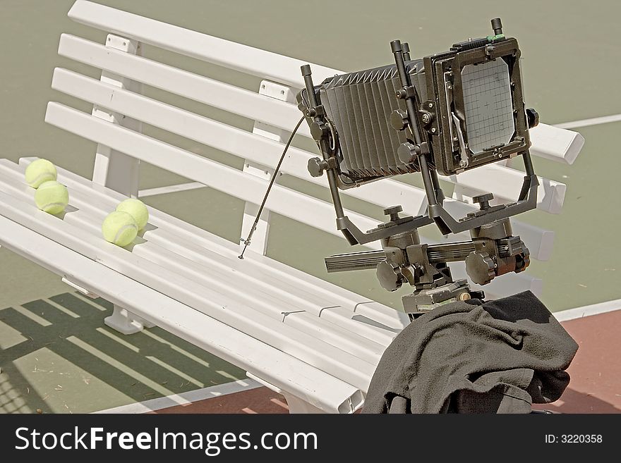 A 4x5 camera is setup to photograph some tennis balls.