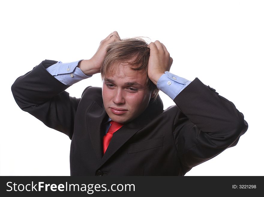 Worried young businessman pulling the hair