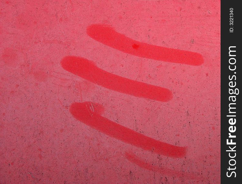 Three red marks on the side of a canoe