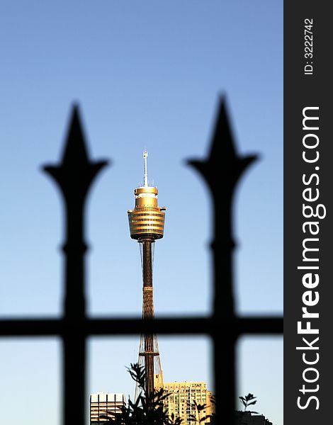 Sydney Tower Between Two Fence Spikes, Focus On Tower, Tallest Building In The Southern Hemisphere, Australia