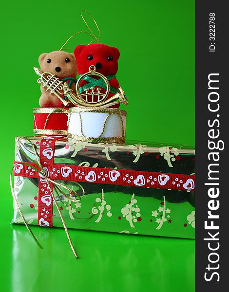 Christmas decoration Teddy Bears on a gold wrapped gift. Christmas decoration Teddy Bears on a gold wrapped gift