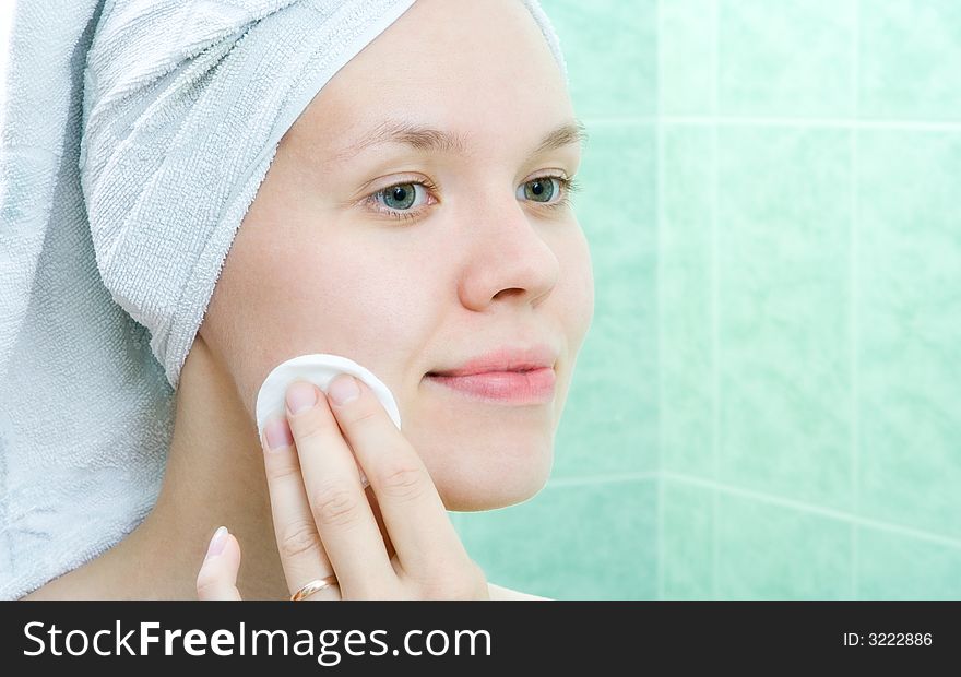 Pretty young woman with tampon in bath room