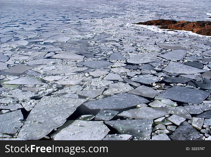 Frozen sea starting to melt with a puzzle of ice. Frozen sea starting to melt with a puzzle of ice