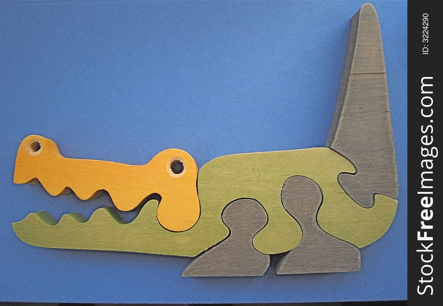 Toy crocodile made from color wood pieces