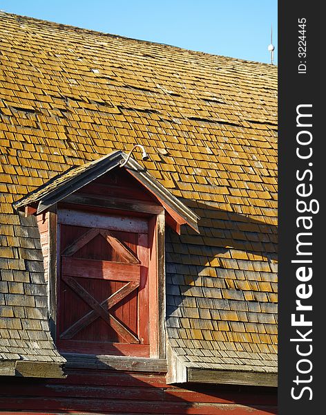 Barn gable on roof during sunset. Barn gable on roof during sunset