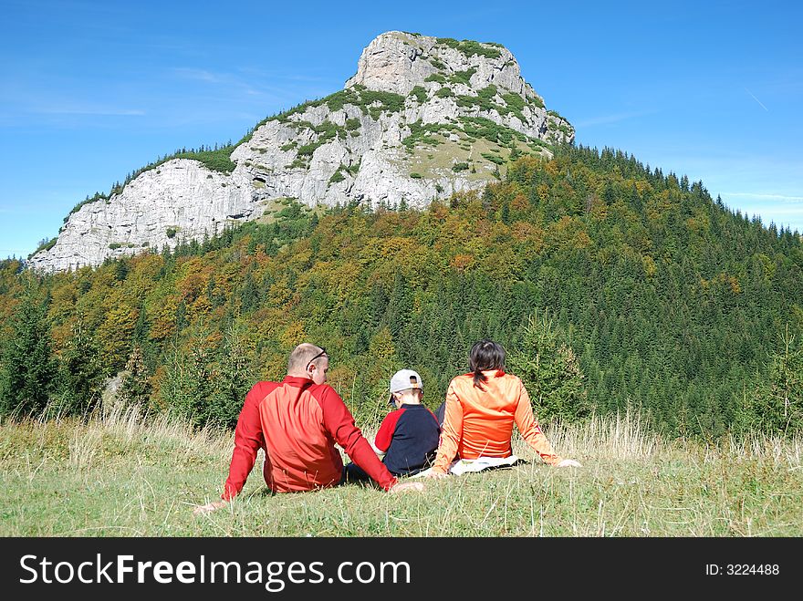Young family relaxing in the beautiful nature. Young family relaxing in the beautiful nature